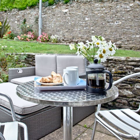 Unwind with tea or cocktails in the quaint cottage garden