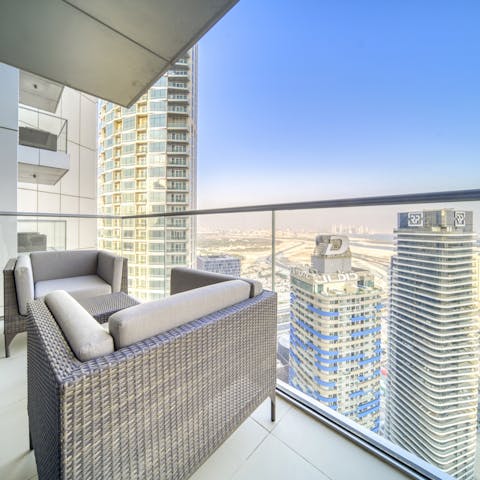 Admire stunning skyscraper views from the glass-fronted balcony