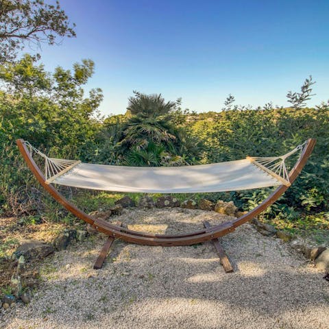 Spend a lazy afternoon relaxing in the hammock