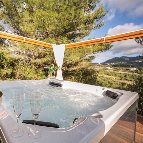 Have a drink in the secluded hot tub
