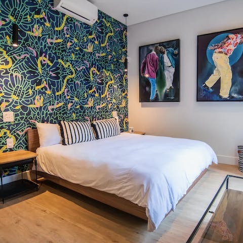 Wake up ready to explore in the stylish bedrooms with trendy local artwork
