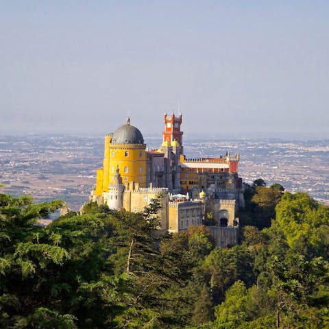 Visit the fairytale-like Palace of Pena in Sintra – a twenty-minute drive down the road