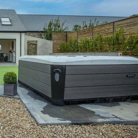 Unwind in the hot tub after a day of exploring the Pembrokeshire coastline
