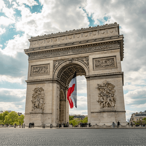 Capture that iconic shot of the Arc de Triomphe, a short walk away
