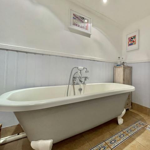 Soak in the roll top tub with a glass of wine after a long day of exploring