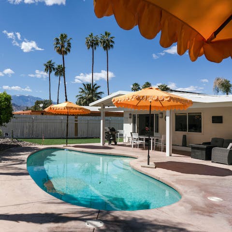 Cool off in the gently palm-shaded swimming pool