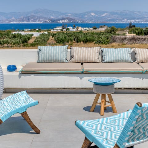 Admire the views of the Aegean Sea from the roof terrace