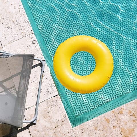 Enjoy a refreshing dip in the pool and lounge poolside in the sun