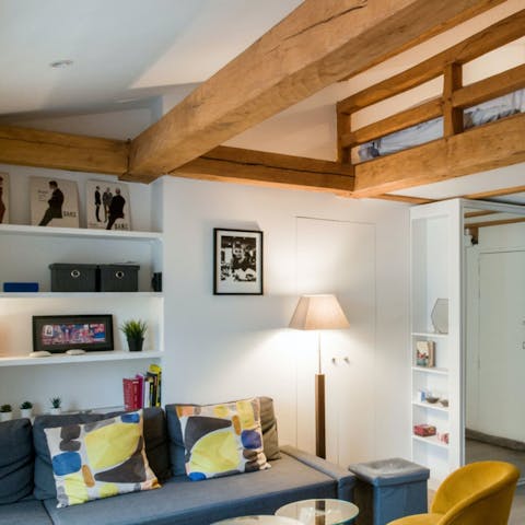 Relax beneath the beams of this charming apartment