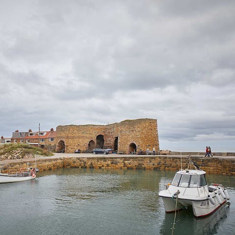 Explore the village of Beadnell and watch the boats bobbing in and out of the waterfront