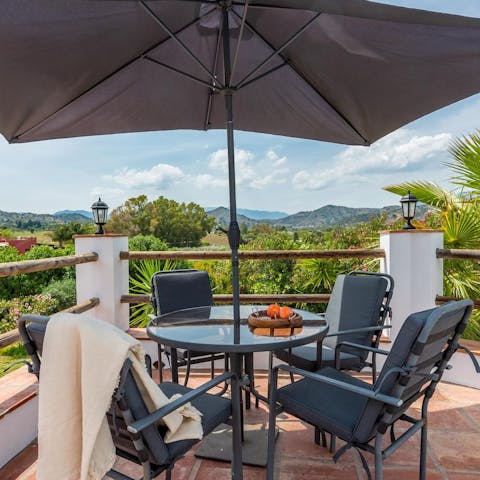 Enjoy drinks on the balcony as you admire the rolling hills on the horizon