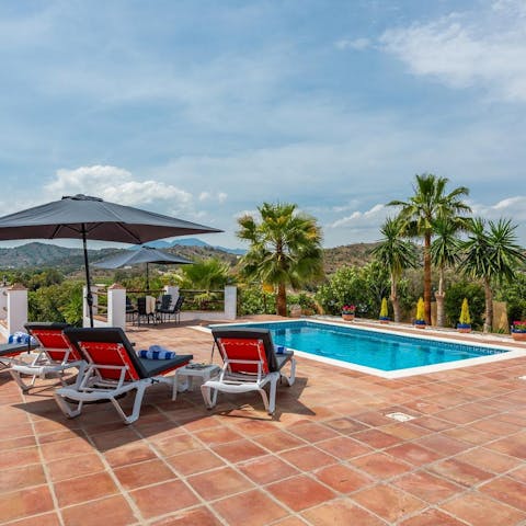 Spend your days between the swimming pool and the shaded sun loungers