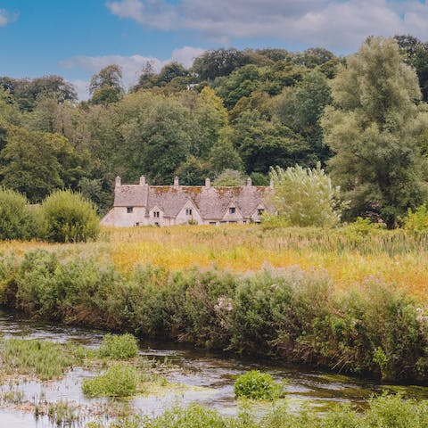Visit the charming village of Bibury, just a six-minute drive from your cottage