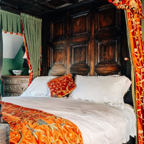 Get some rest in the antique four-poster bed