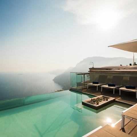 Admire stunning views of Positano and the coast from the infinity pool