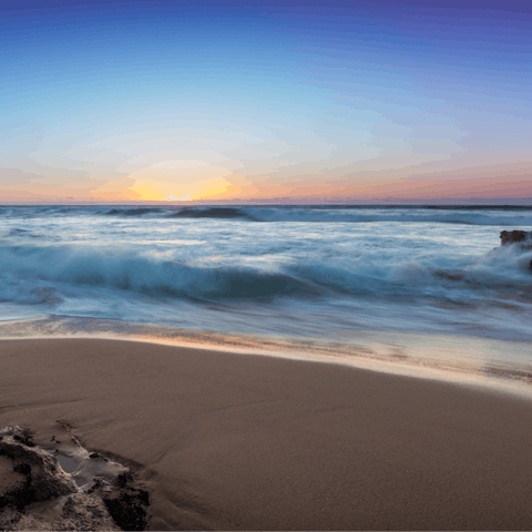 Catch the sunset at the sandy Guincho Beach