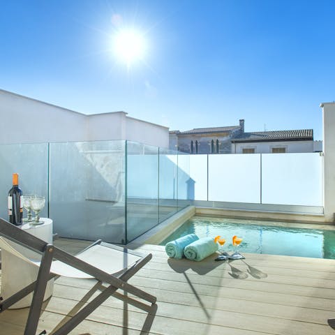 Soak up the sunshine from your private decked terrace and pool