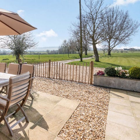 Sit out in the courtyard and enjoy the far-reaching Cotswolds views