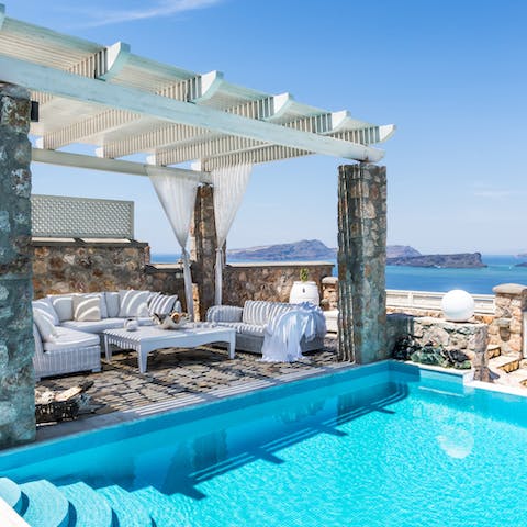 Savour beautiful Aegean views while relaxing by the pool