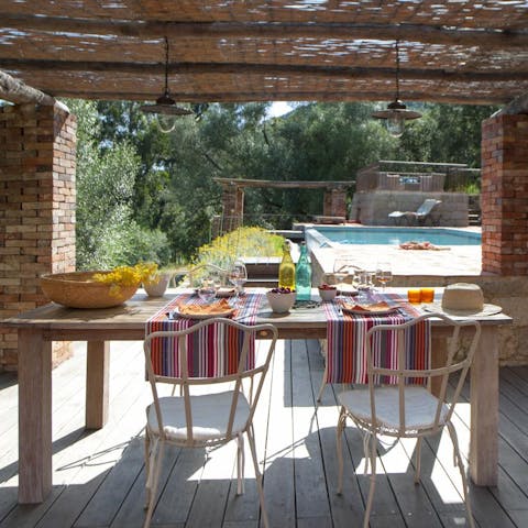 Drink or dine alfresco on the deck beside the pool
