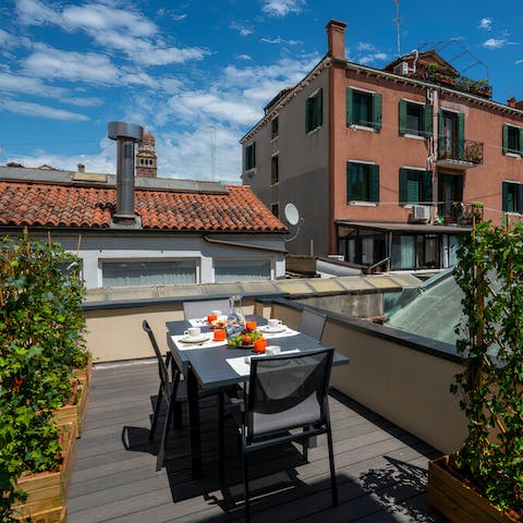 Dine alfresco with rooftop views on the terrace