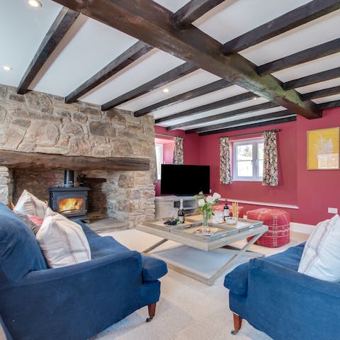 Curl up in the cosy living room with the crackling fire and a movie