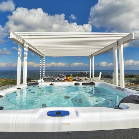 Take in the sea views from the hot tub
