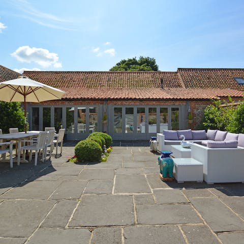 Open up the French doors and make the most of the lovely patio