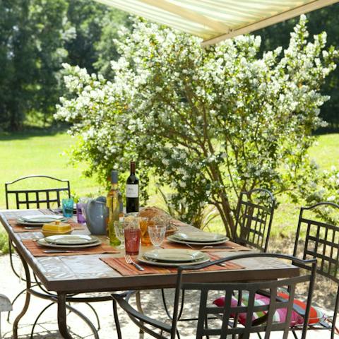 Tuck into some local delicacies like tarte aux noix on the shaded terrace