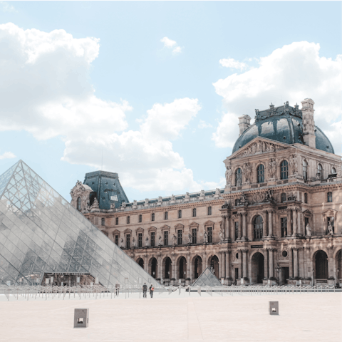 Spend time exploring the iconic Louvre Museum, just a short walk away