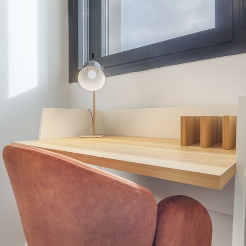 Catch up on emails from the laptop-friendly workspace