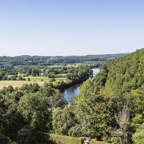 Views as far as the eye can see over ancient woodland and the Dordogne river