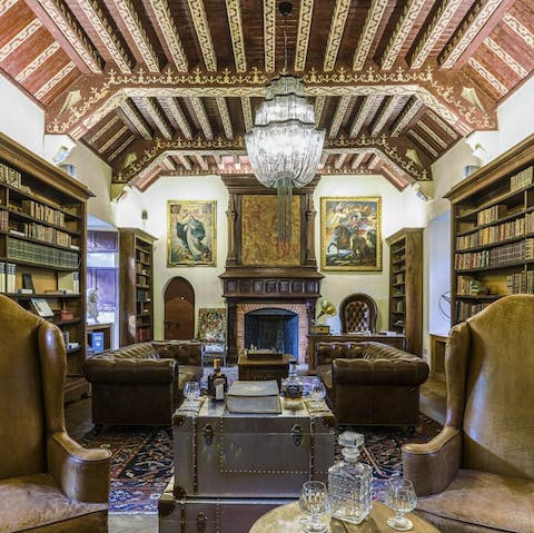 A splendid library with original stencilled ceilings and leather-bound books in the bookshelves
