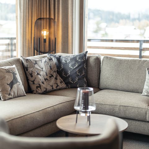Unwind in the comfy living area while soaking up views of the Kitzbühel Alps