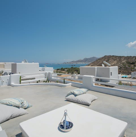 Admire the views of the Aegean Sea and Portara from the roof terrace