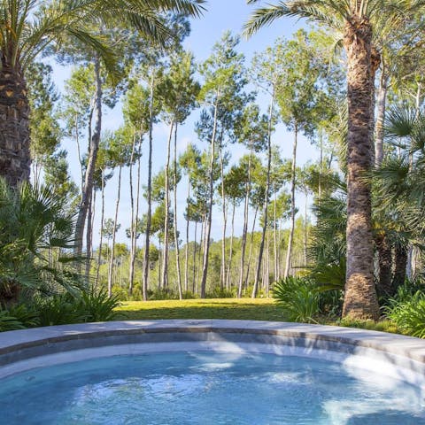 Sink into the jacuzzi while sipping a glass of wine