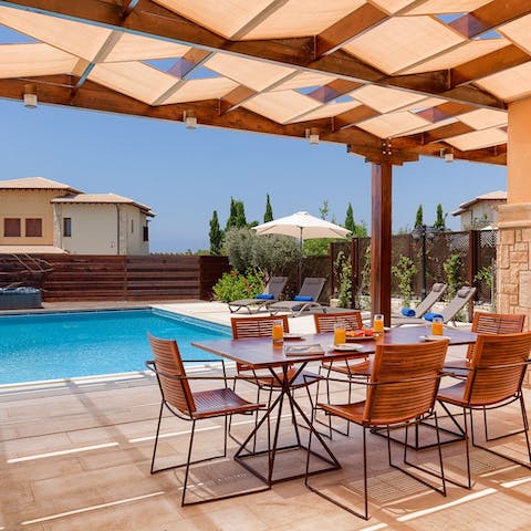 Enjoy alfresco dining by the private pool on the veranda