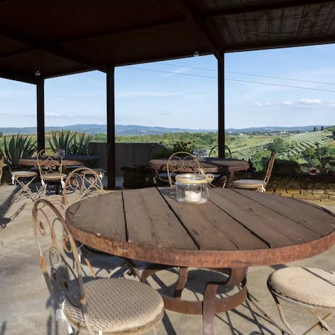 Take in the rolling hills of olive groves and vineyards while sipping on a local wine