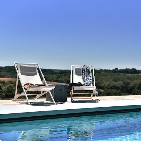 Soak up the sunshine and views of the Dordogne from the poolside