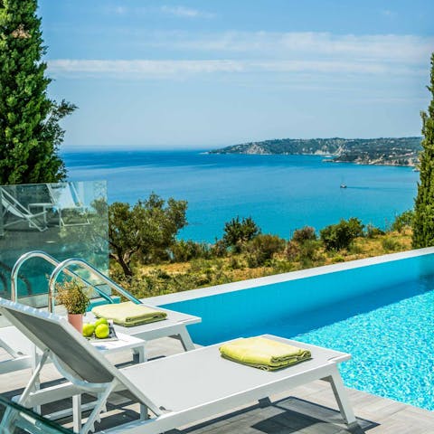 Enjoy idyllic views across Lourdas whilst lounging by the pool