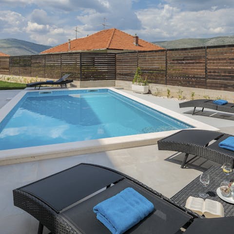 Spend your afternoons lounging in the sun and cooling off in your villa's pool