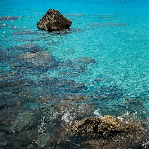 Swim the crystal clear waters off Cala Deià, just 600m away