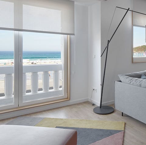 Enjoy gazing out at the gorgeous view of the sea from the large living room windows