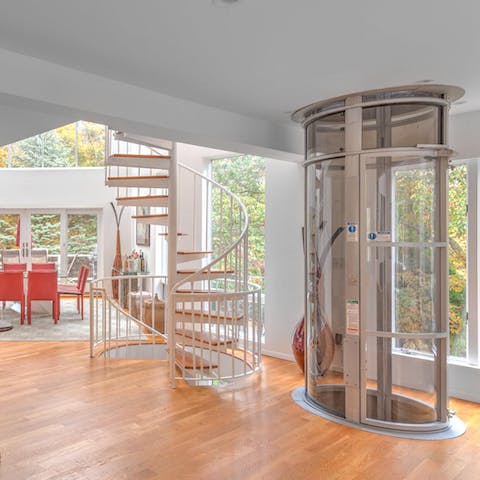 Get from A to B in style, on the spiral staircase or in the home's lift
