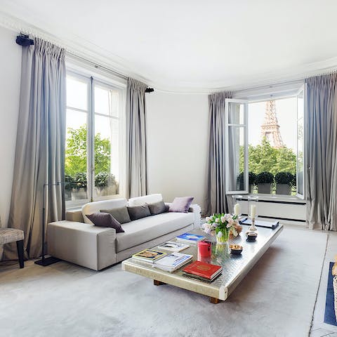Admire the incredible view of the Eiffel Tower from the chic living room