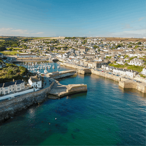 Stroll along Porthleven's beautiful harbour and watch the boats drift by