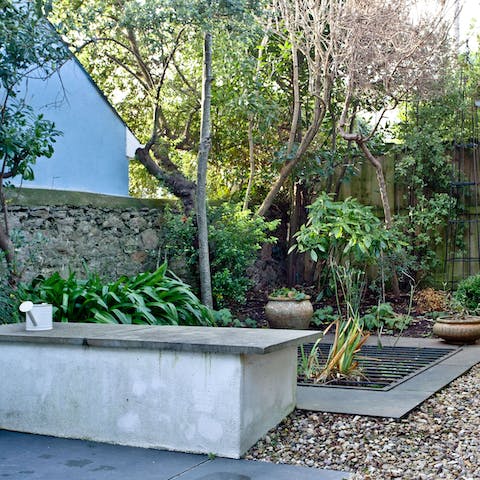 Test your green thumb in the flora and shrubbery filled private patio 