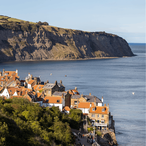 Take a scenic, fifteen-minute drive along the coast to Robin Hood's Bay