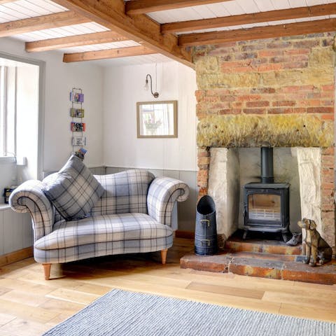 Cosy up by the roaring wood burning stove