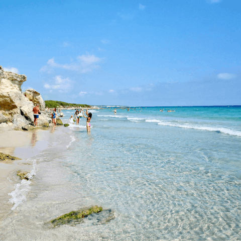 Stroll down to the pebbled and rocky shores of Lido Cala Paura